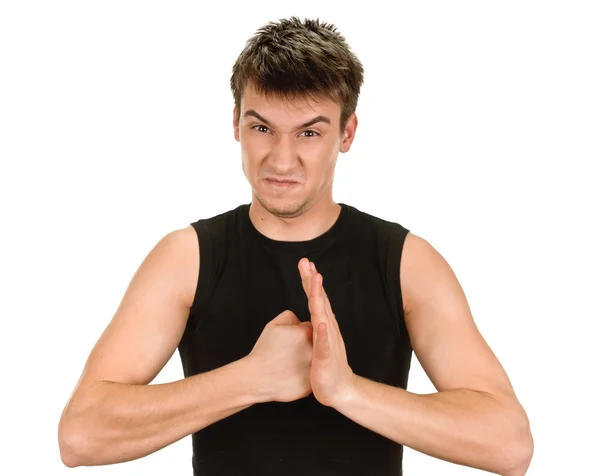 Exited young man kicks clenched fist arm — Stock Photo, Image