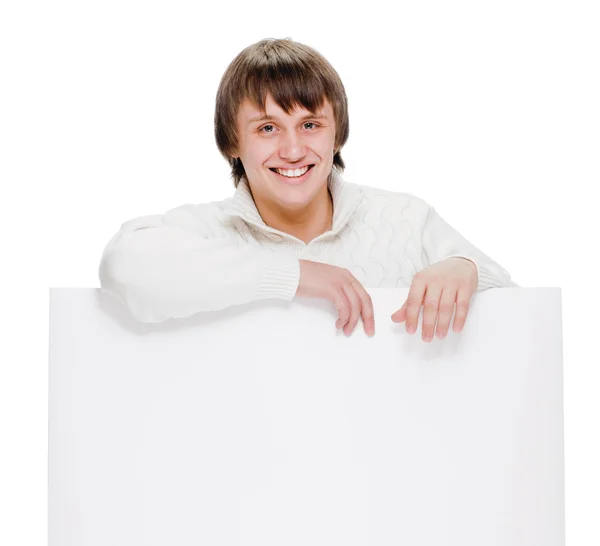 Young man with blank billboard — Stok Foto