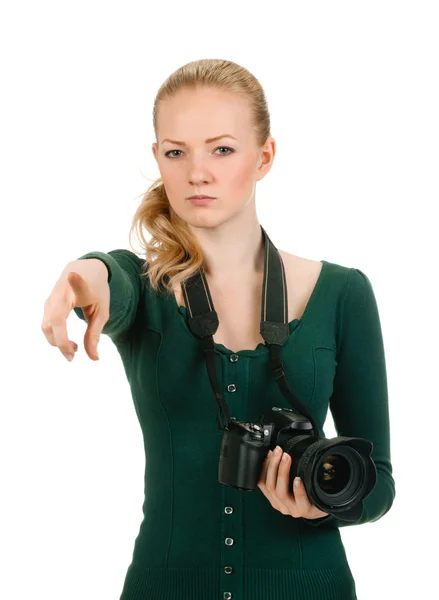 Beauty woman holding a camera and pointing — Stock Photo, Image