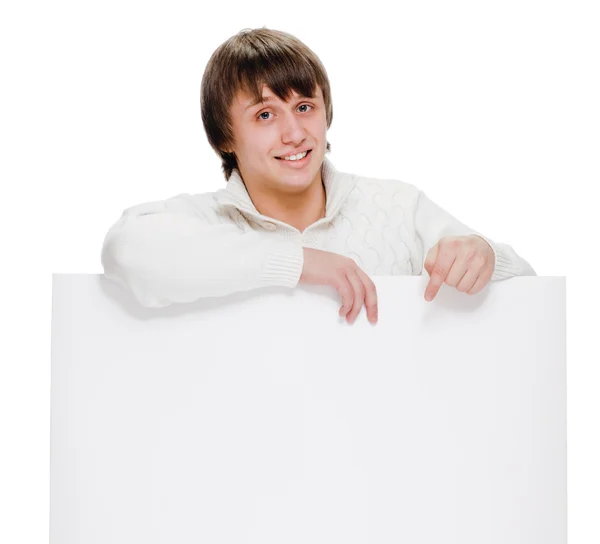 Young man with blank billboard — Stok Foto