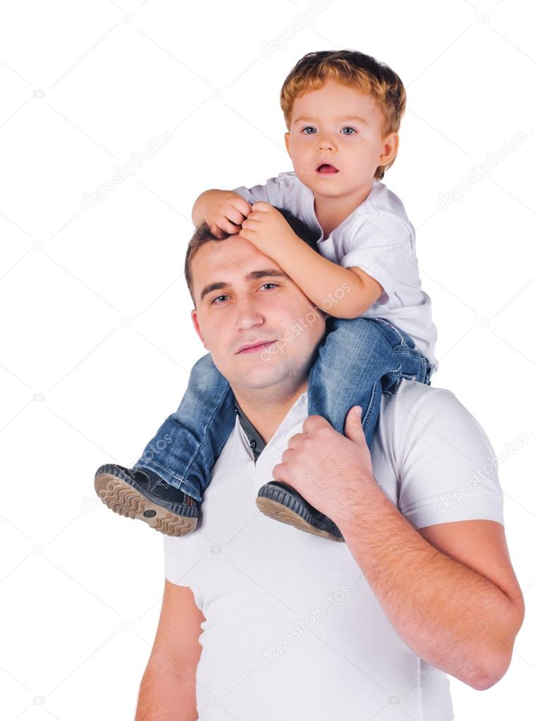 father giving his son piggyback ride