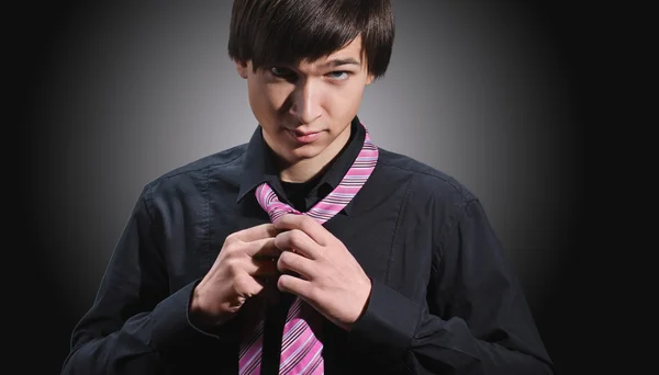 Man adjusting tie — Stock Photo, Image