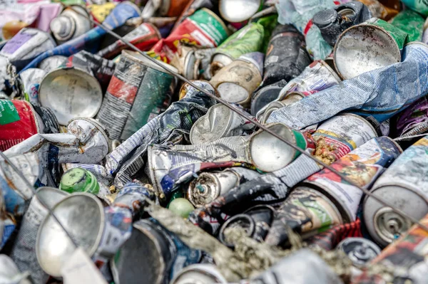 Pressed aerosol cans, waste recycling