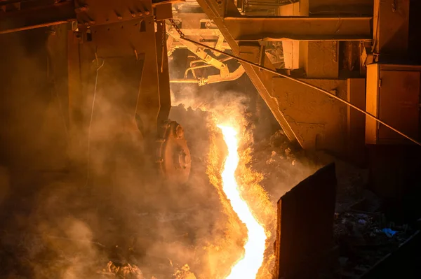 The flow of molten hot metal, molten steel flows along the guide chute. Blast furnace