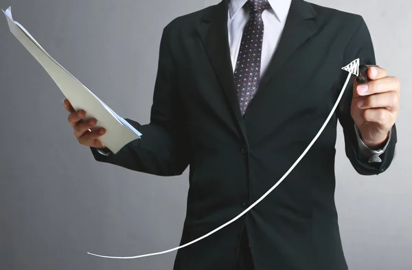 Businessman drawing graphics  growing graph — Stock Photo, Image