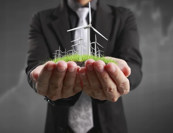 Eco power, wind turbines in  hand — Stock Photo, Image