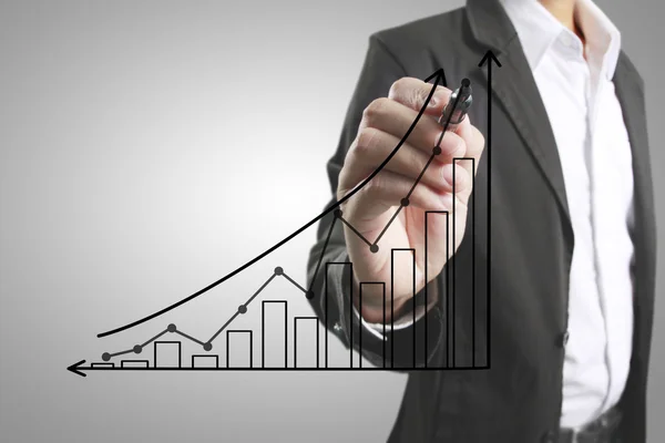 Businessman drawing graphics  growing graph — Stock Photo, Image