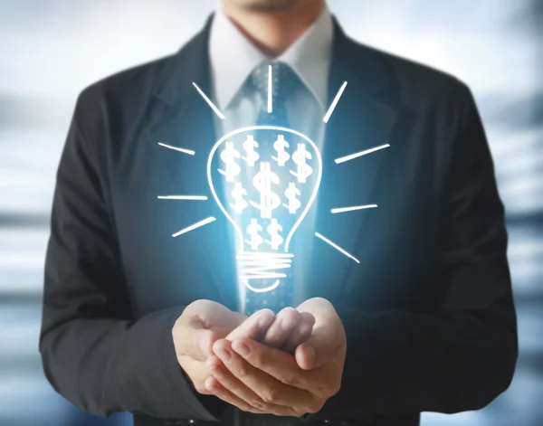 Business person anläggning lampa — Stockfoto