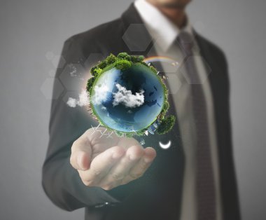 Küre, dünya insan elinde parlayan bizim seyyare yerküre tutan el