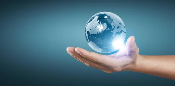 Globe in hand, Earth energy saving concept, Elements of this image furnished by NASA
