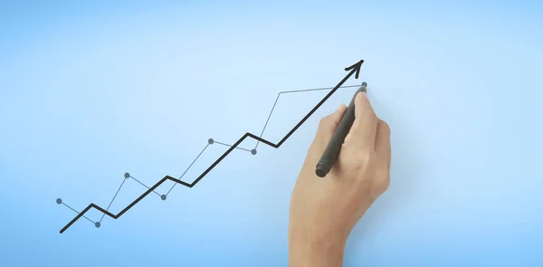 グラフを描く手 成長のグラフの株式 ストック画像