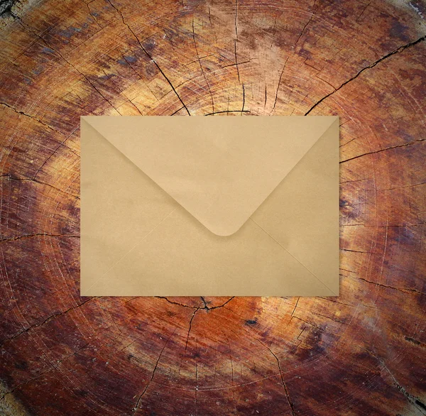 Envelope on wood — Stock Photo, Image