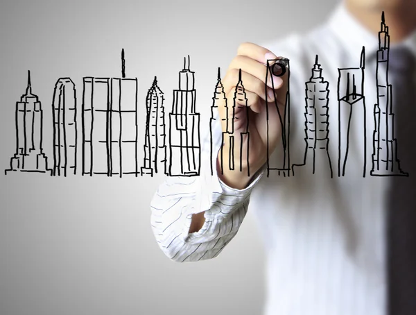 Hand tekenen huis in een whiteboard — Stockfoto