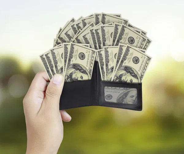 Hands as he is getting a banknote out of his wallet — Stock Photo, Image