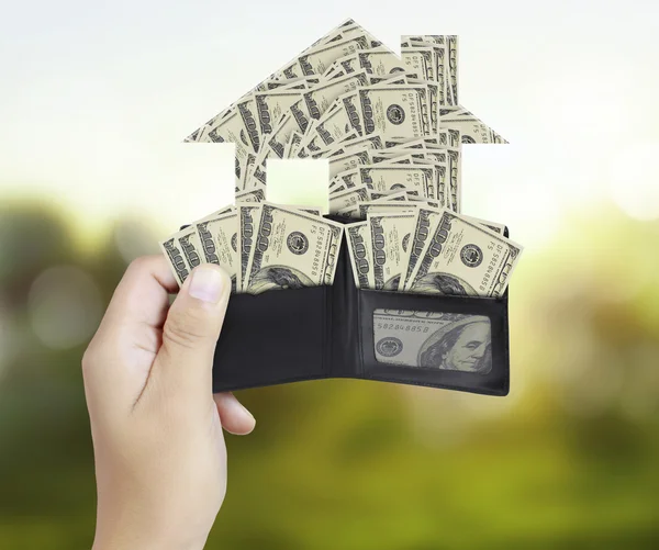 Hands as he is getting a banknote out of his wallet — Stock Photo, Image