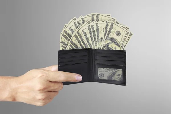 Hands as he is getting a banknote out of his wallet — Stock Photo, Image