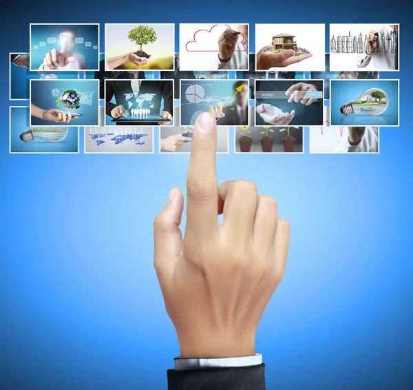 Man pushing on a touch screen digital photos — Stock Photo, Image