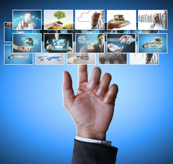 Man pushing on a touch screen digital photos — Stock Photo, Image