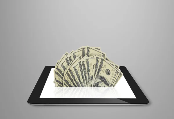 Tablet showing financial symbols coming — Stock Photo, Image