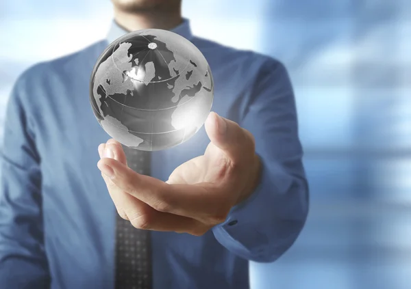 Holding a glowing earth globe in his hands. Earth image provided — Stock Photo, Image