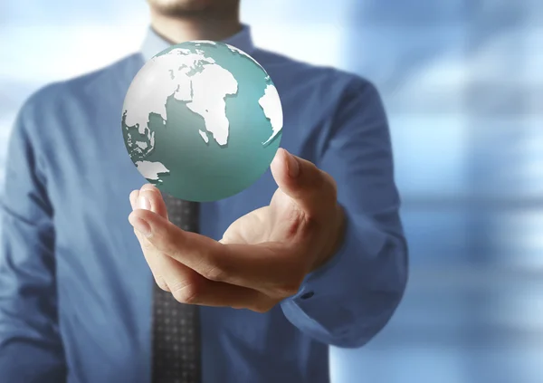 Holding a glowing earth globe in his hands. Earth image provided — Stock Photo, Image