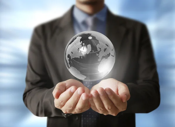 Holding a glowing earth globe in his hands. Earth image provided — Stock Photo, Image