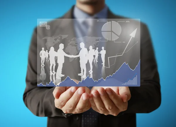 Businessman holding business graph — Stock Photo, Image