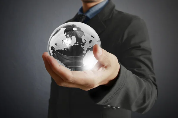 Holding a glowing earth globe in his hands. Earth image provided — Stock Photo, Image