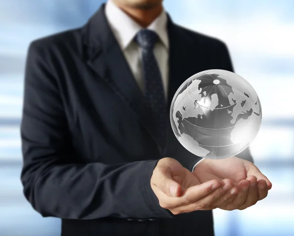 Holding a glowing earth globe in his hands. Earth image provided — Stock Photo, Image