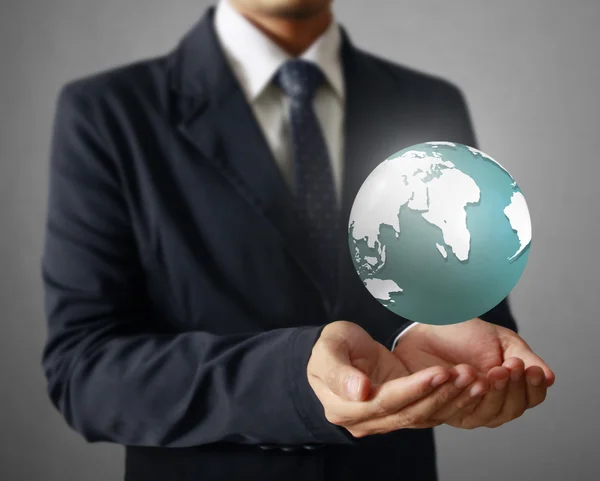 Holding a glowing earth globe in his hands. Earth image provided — Stock Photo, Image