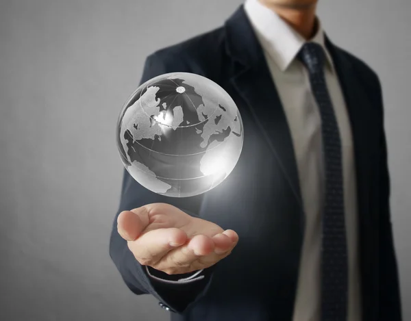 Holding a glowing earth globe in his hands. Earth image provided — Stock Photo, Image