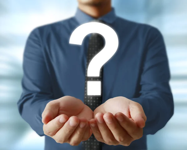 Man holding question mark — Stock Photo, Image