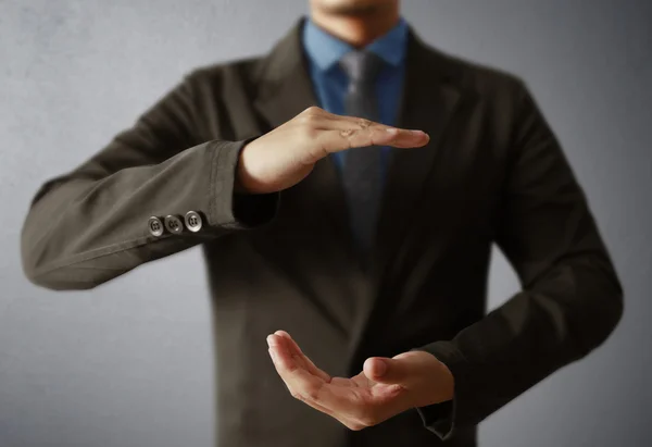 Businessman with open hands gesture