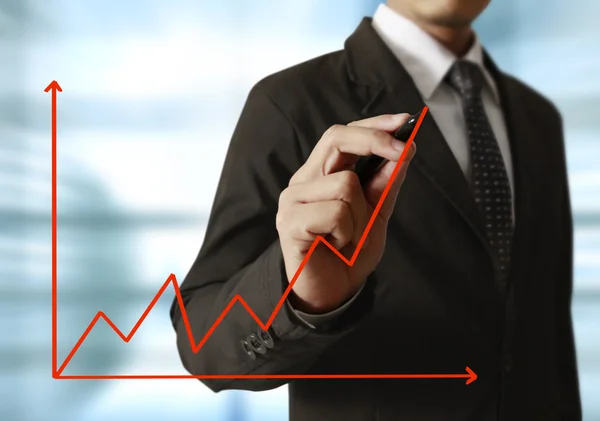 Geschäftsmann Hand schreibt ein Business Graph — Stockfoto