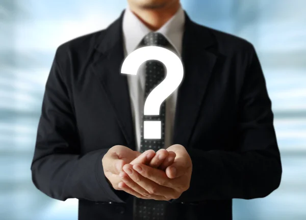 Man holding question mark — Stock Photo, Image