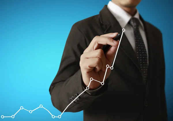 Businessman hand writing  business graph — Stock Photo, Image