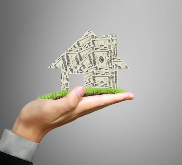 Businessman holding house model — Stock Photo, Image