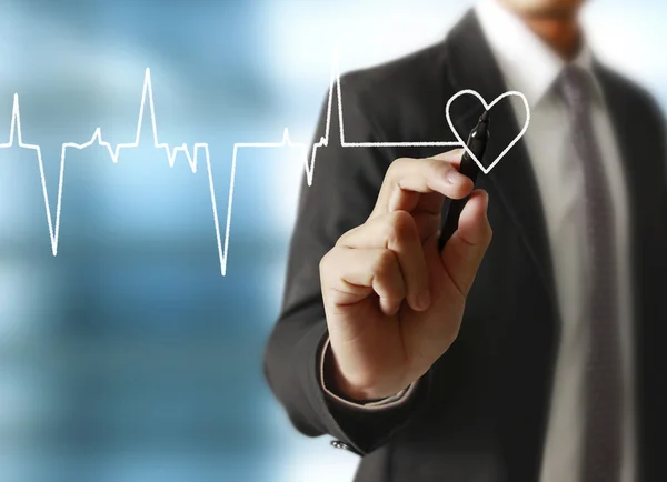 Man drawing a growing graph — Stock Photo, Image