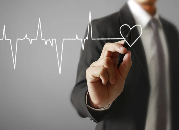 Man drawing a growing graph — Stock Photo, Image