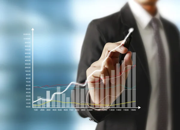 Man drawing a growing graph — Stock Photo, Image