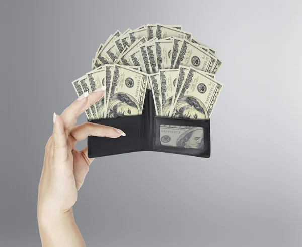 Dollar in  black leather wallet in hand — Stock Photo, Image