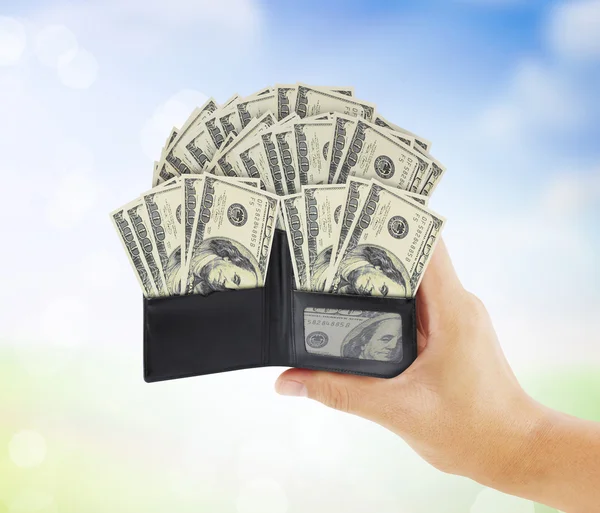 Dollar in  black leather wallet in hand — Stock Photo, Image