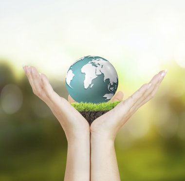Küre, dünya insan elinde parlayan bizim seyyare yerküre tutan el