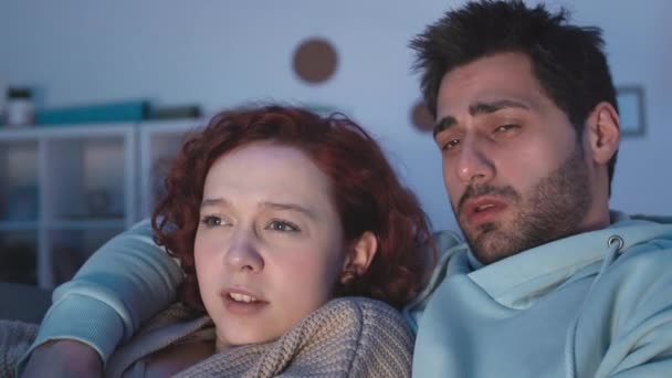 Close Diverse Young Couple Snuggling Home Watching Disgusting Movie Scene — Stock Video