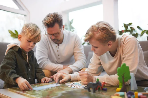 Portrait Loving Father Spending Time Two Sons Playing Board Games — стоковое фото