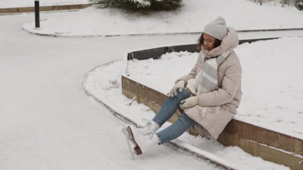 Wide Shot Young Mixed Race Woman Sitting Outdoor Skating Rink — Stock Video