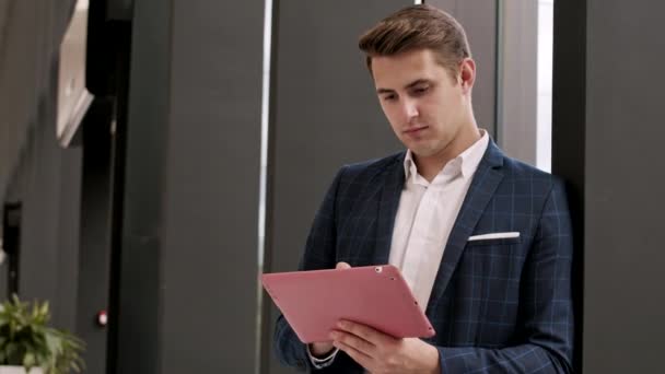 Medium Shot Young Caucasian Businessman Standing Office Hall Tablet Hands — Stock video