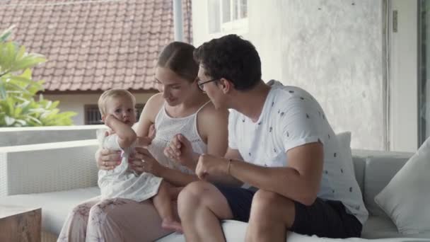 Medium Long Shot Young Caucasian Family Couple Baby Sitting Couch — Vídeo de stock