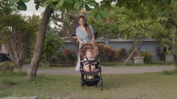 Long Tracking Happy Caucasian Toddler Sitting Stroller Shaking Head Long — Stock Video