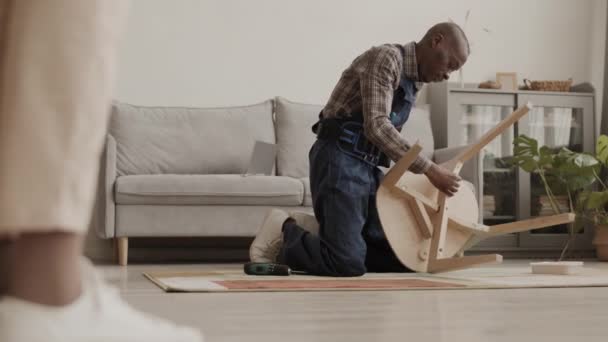 Lockdown Legs Unrecognizable Woman Standing Living Room Watching African Handyman — Stock Video